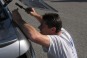 McMullan uses a hammer